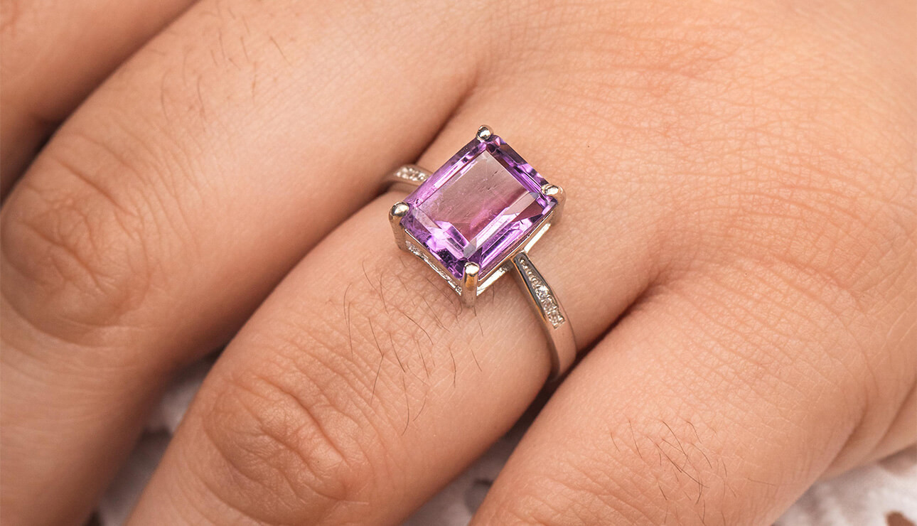 Our Best Amethyst Engagement Rings: person wearing ring