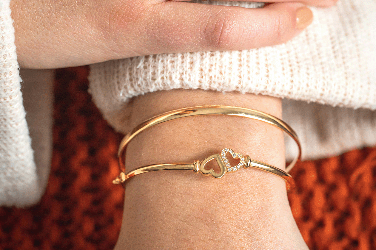 A Guide To Our Favourite Dainty Jewellery: image of bangles on hand