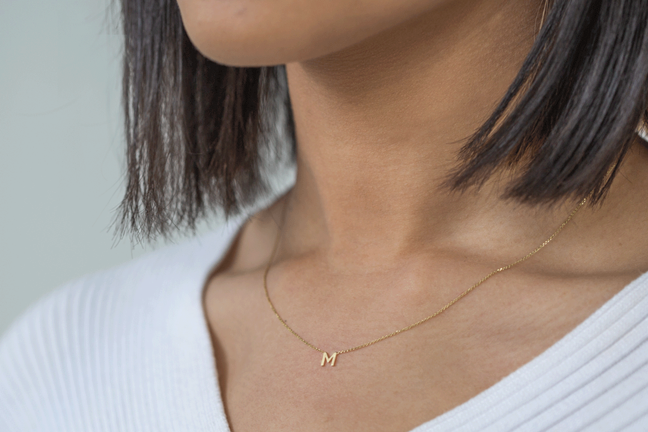 A Guide To Our Favourite Dainty Jewellery: image of an 'm' necklace