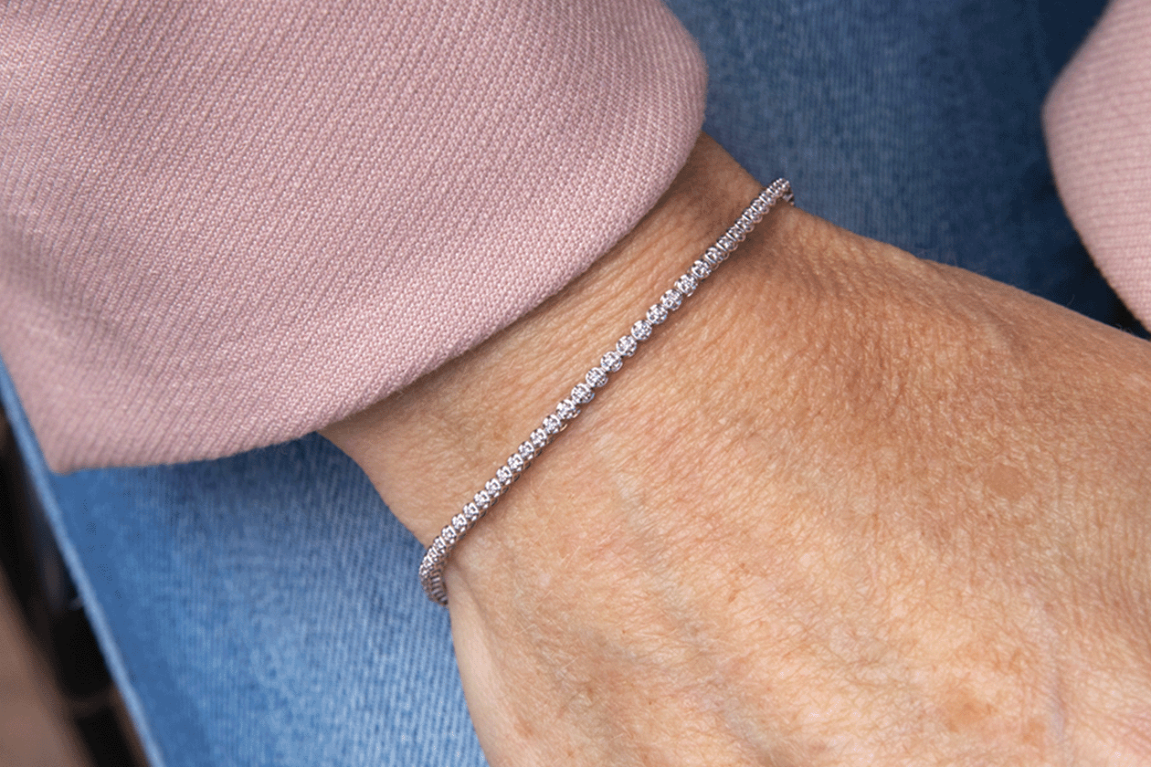 A Guide To Our Favourite Dainty Jewellery: image of a diamond bracelet on hand 