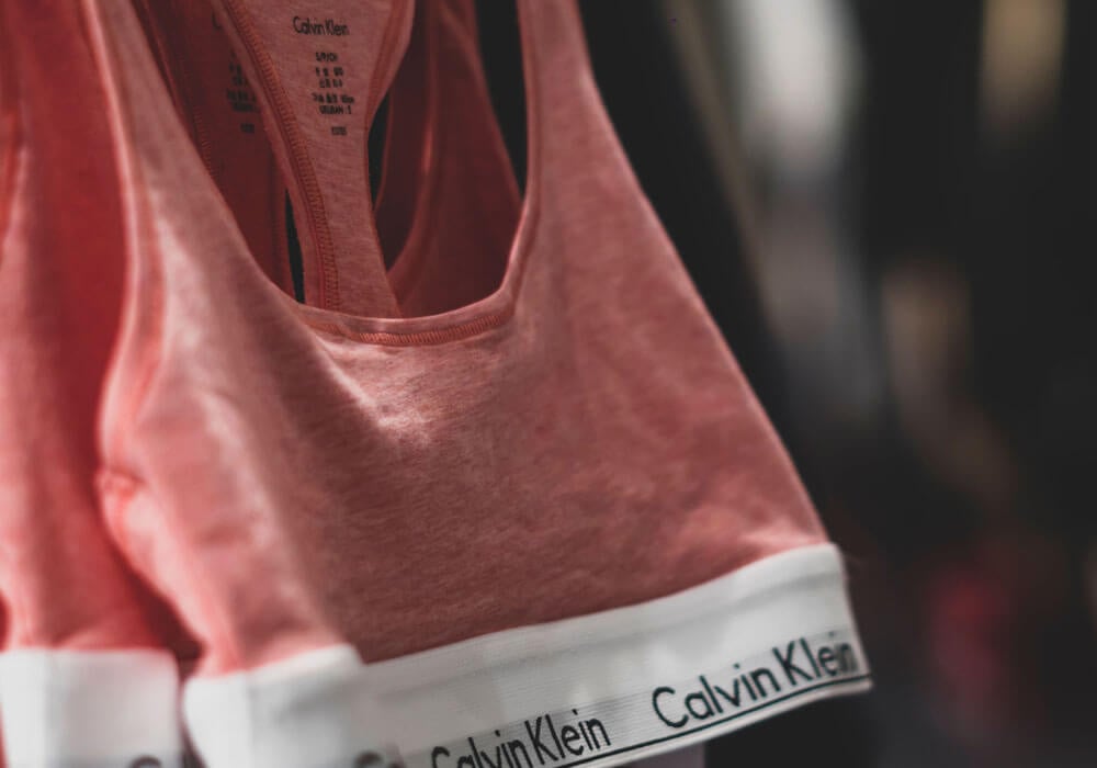 How Calvin Klein Started - Calvin Klein apparel hanging up