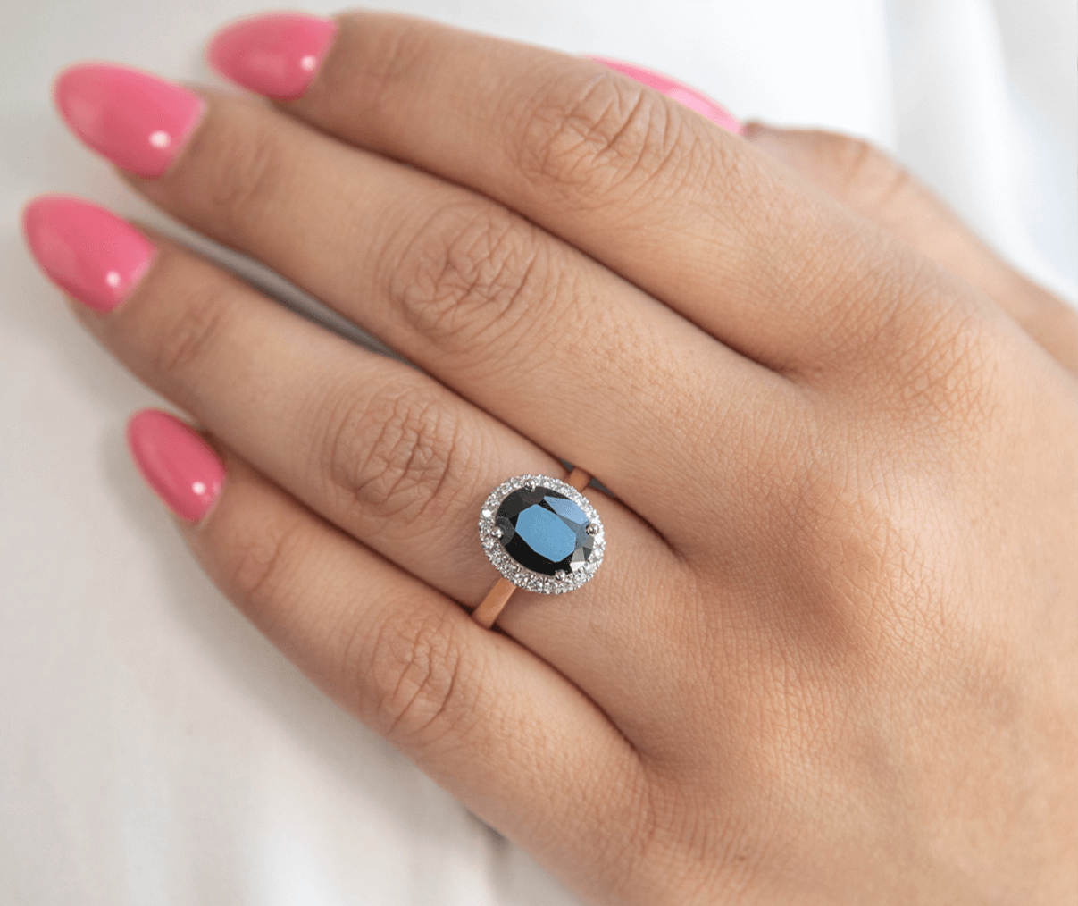 best Sapphire Engagement Rings: ring on hand
