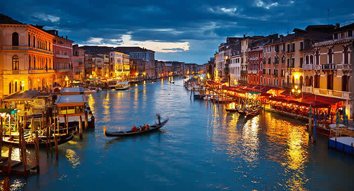 A loving couple riding a gondola in Venice